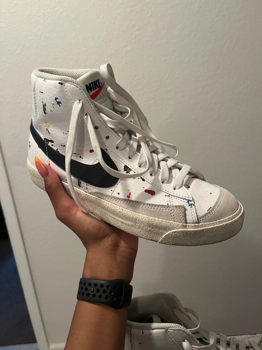 Nike White High-Top Sneakers with Black Swoosh and Multicolor Paint Splatter